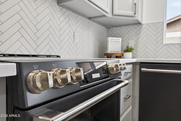 a close view of shoes sitting on a kitchen