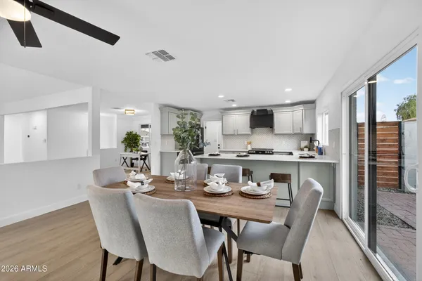 a dining room with furniture and window