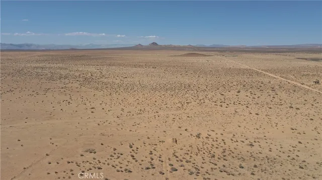 a bathroom with a granite countertop sink and white cabinets