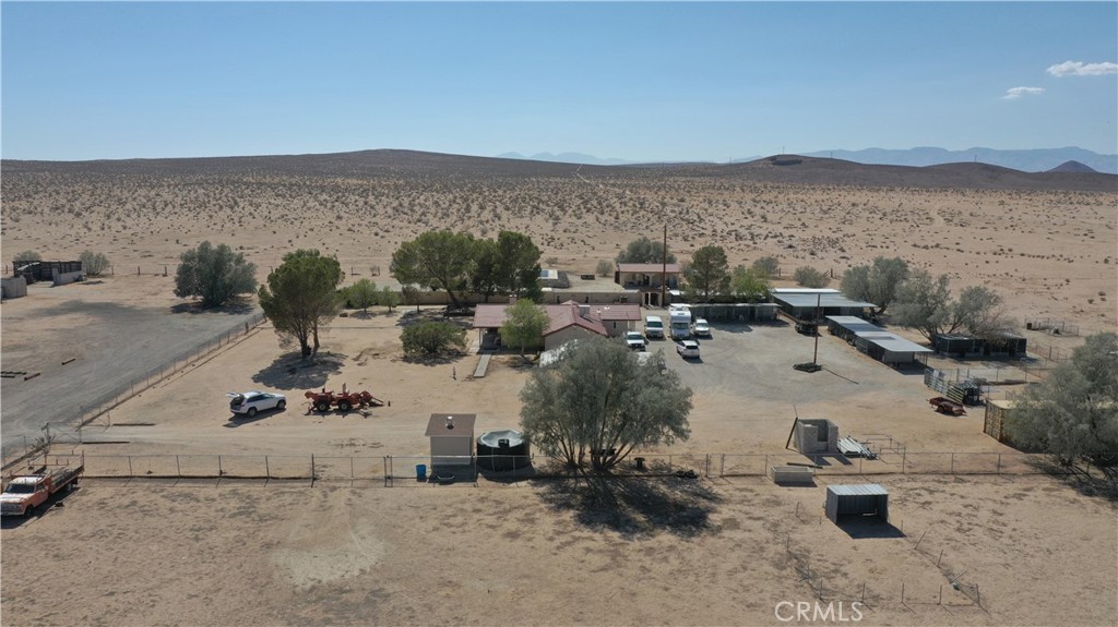 14637 Castle Butte Road North Edwards, CA 93523 - Photo 10 of 18 a view of a terrace with a table and chairs under an umbrella