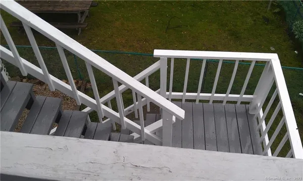 a view of deck with wooden floor and fence