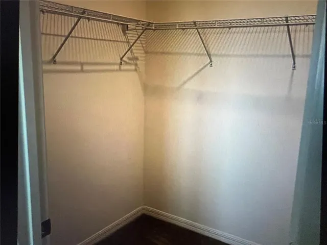 a bathroom with a toilet a sink and a mirror