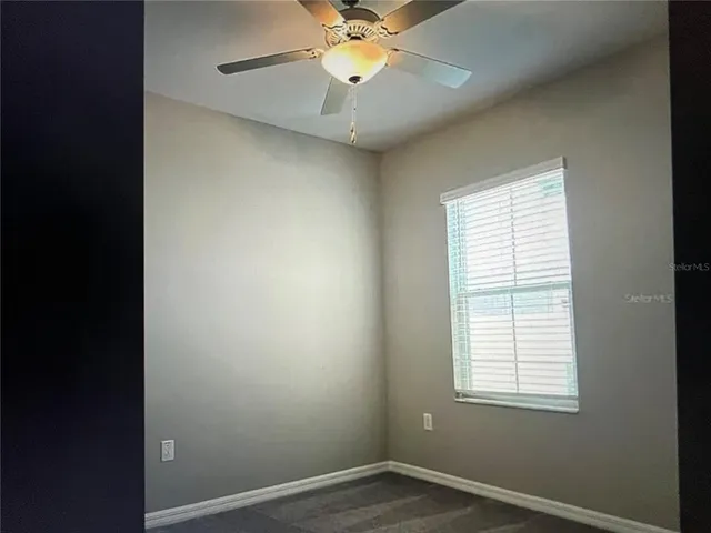 a view of an empty room with empty shelves