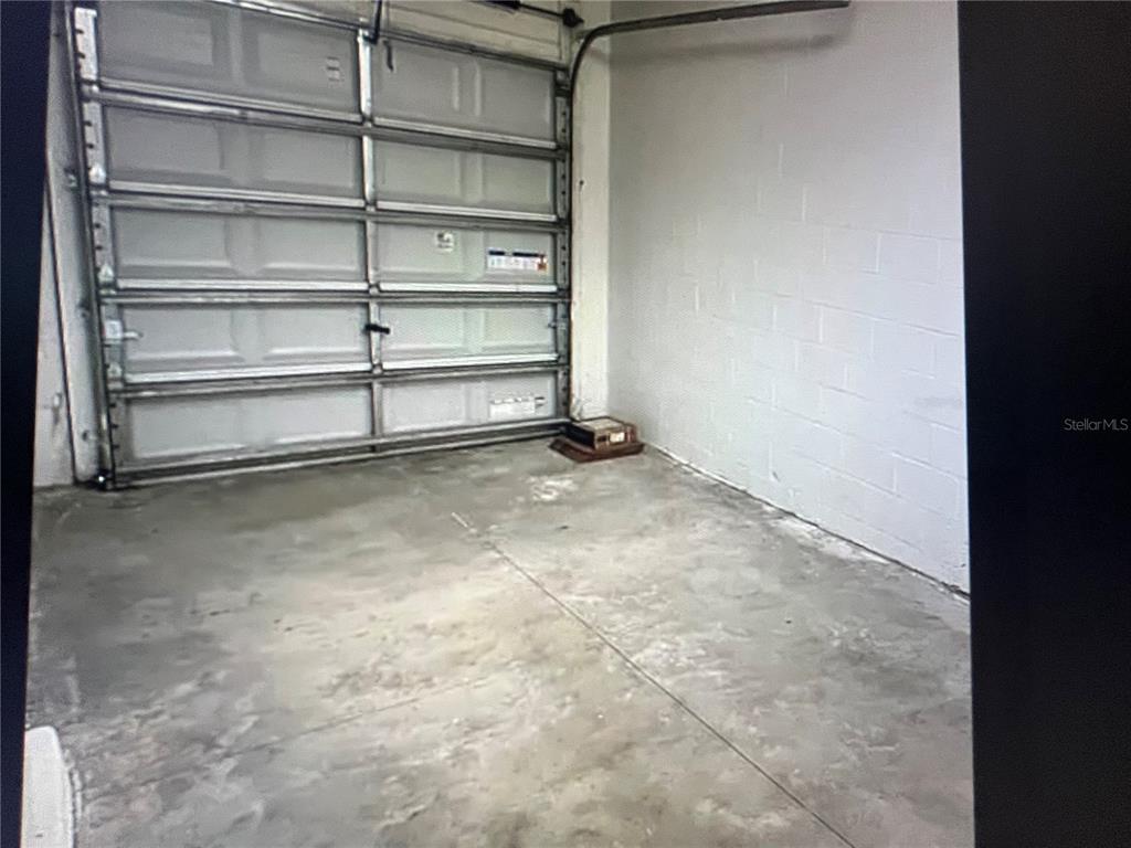 31611 Blue Passing Loop Wesley Chapel, FL 33545 - Photo 18 of 18 a view of an empty room with empty shelves