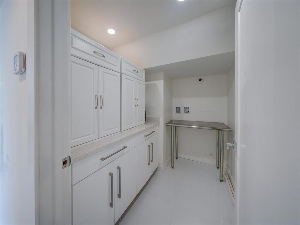 2500 East Las Olas Boulevard, Unit 707 Fort Lauderdale, FL 33301 - Photo 17 of 29 a bathroom with white cabinets