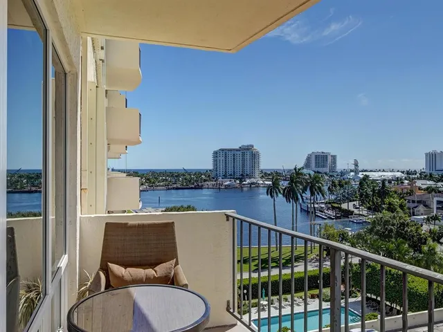 a view of a balcony with furniture