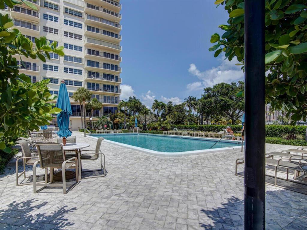 2500 East Las Olas Boulevard, Unit 707 Fort Lauderdale, FL 33301 - Photo 26 of 29 a view of a patio with a table and chairs