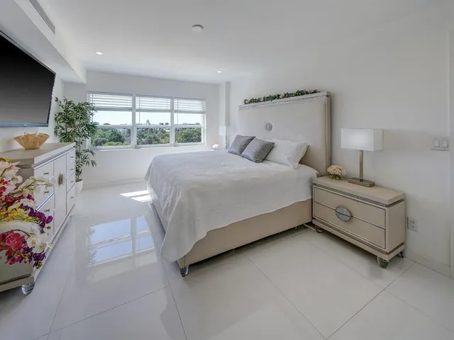 a bed room with a bed and a window