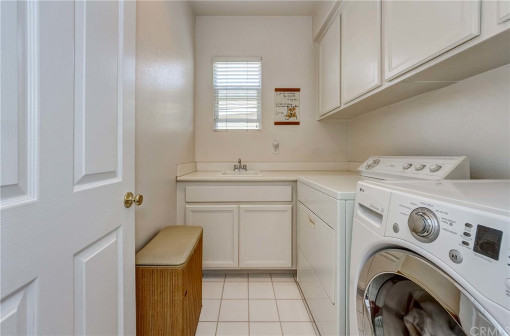 11 Mariner Cove Buena Park, CA 90621 - Photo 56 of 74 Laundry Room Upstairs with Sink and Cabinets
