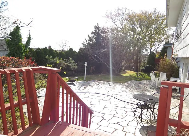 a view of a swimming pool with a table and chairs