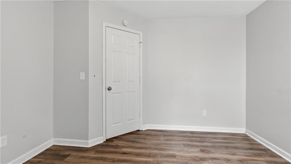 4890 Wilkins Station Drive Decatur, GA 30035 - Photo 20 of 34 a view of an empty room with wooden floor
