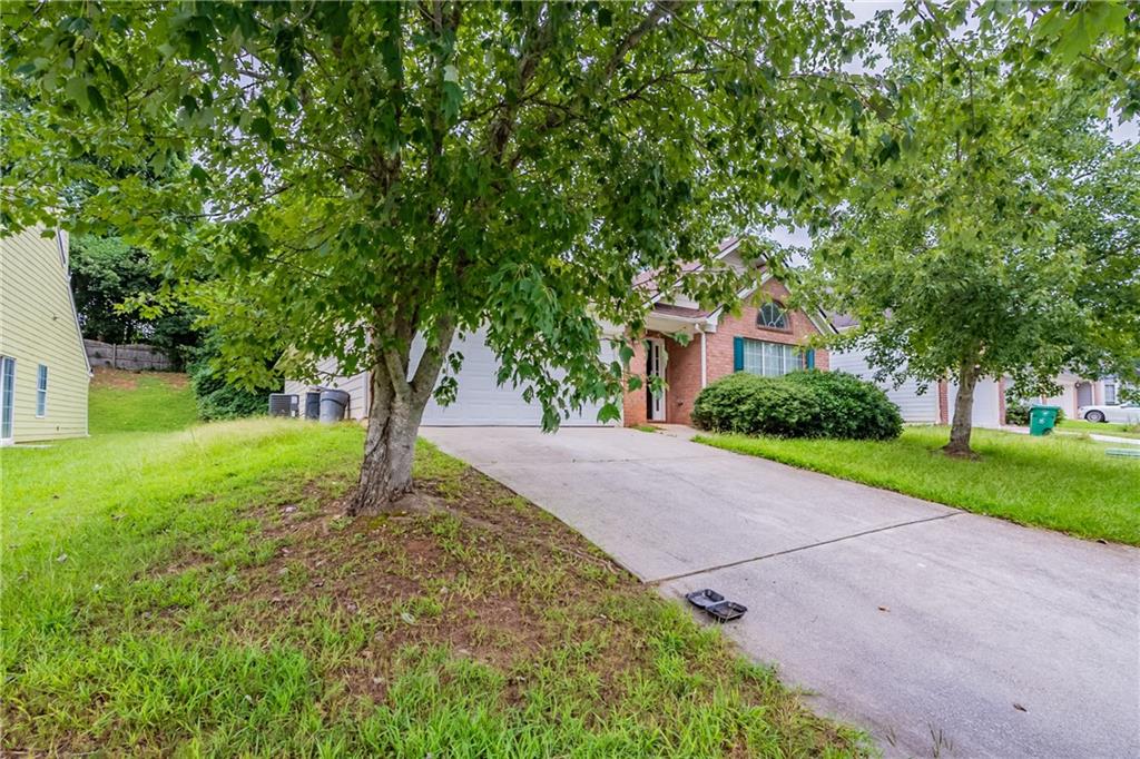 4890 Wilkins Station Drive Decatur, GA 30035 - Photo 2 of 34 a view of a yard with plants and trees