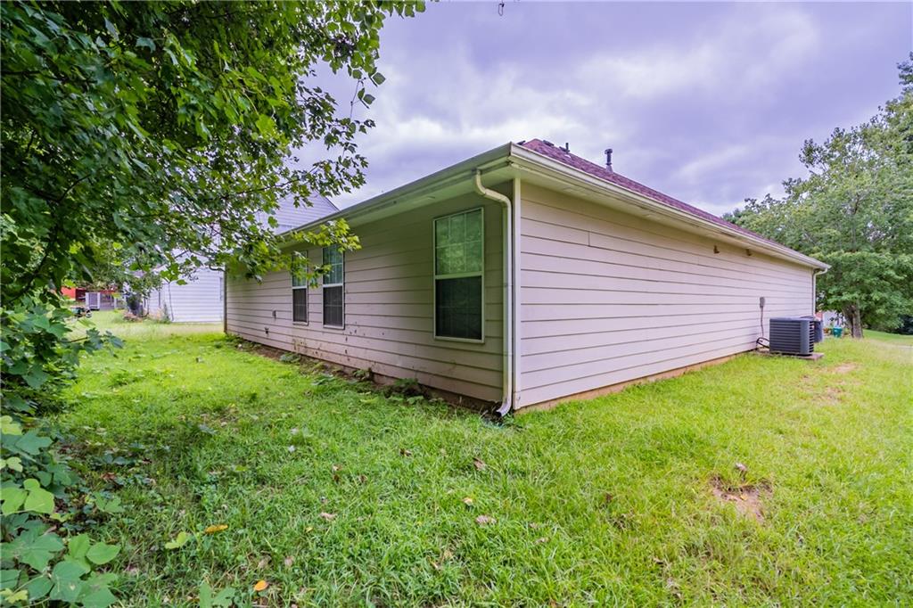 4890 Wilkins Station Drive Decatur, GA 30035 - Photo 32 of 34 a backyard of a house with lots of green space