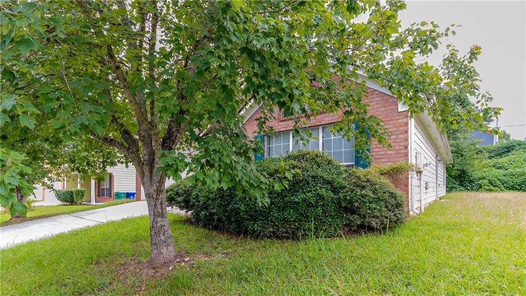 4890 Wilkins Station Drive Decatur, GA 30035 - Photo 4 of 34 a view of a house with a yard