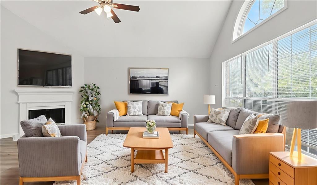 4890 Wilkins Station Drive Decatur, GA 30035 - Photo 5 of 34 a living room with furniture fireplace and a flat screen tv
