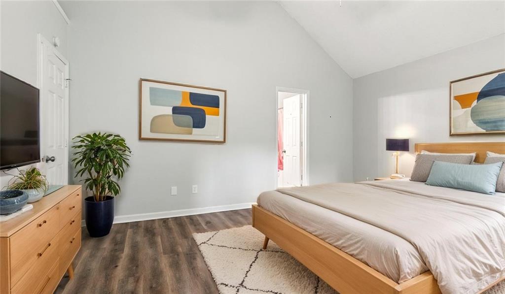 4890 Wilkins Station Drive Decatur, GA 30035 - Photo 9 of 34 a bedroom with a bed and a potted plant