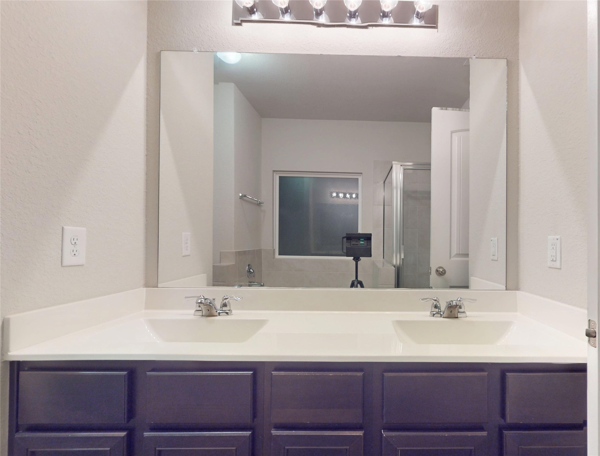 3535 Cannon Drive Conroe, TX 77301 - Photo 19 of 49 a bathroom with a sink and a mirror