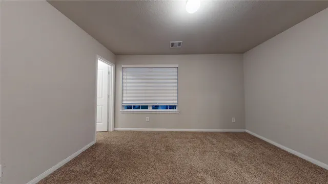 a view of front door of house with yard