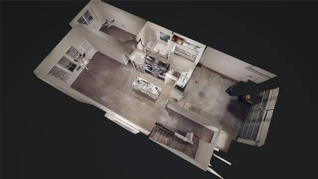 a view of a hallway with entryway and wooden floor