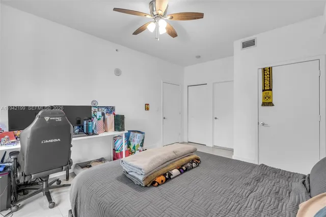 a bedroom with a workspace