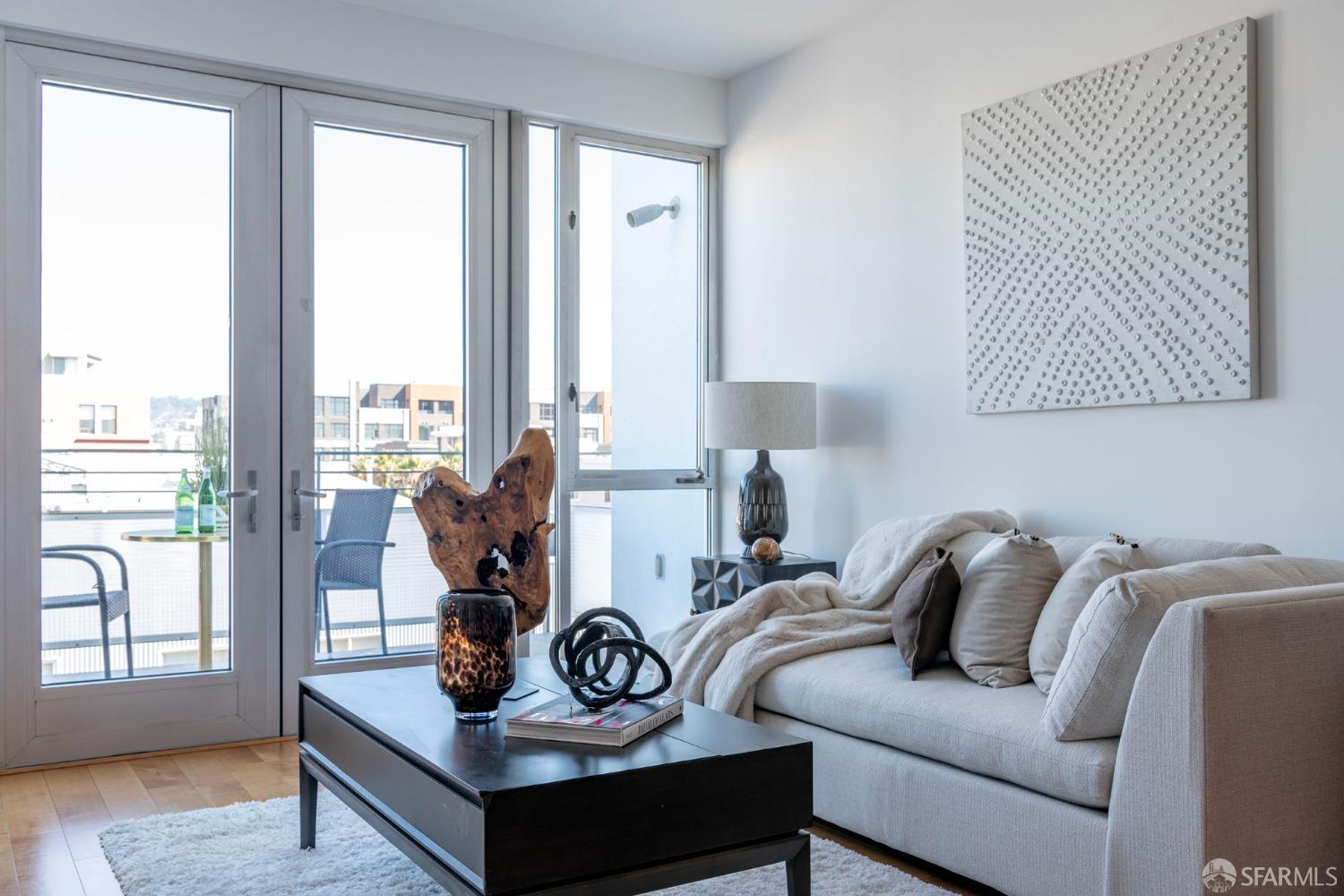 200 2nd Street, Unit 503 Oakland, CA 94607 - Photo 23 of 24 a living room with furniture and floor to ceiling windows