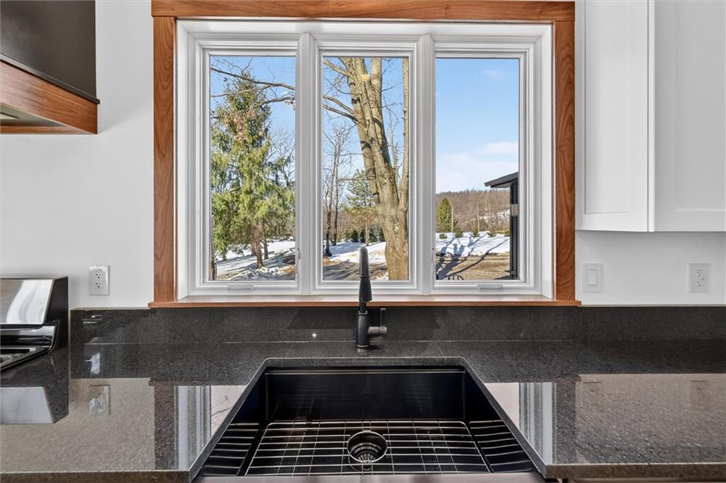 392 Stuber Road Beaver Falls, PA 15010 - Photo 14 of 48 a kitchen with granite countertop a sink and a stove