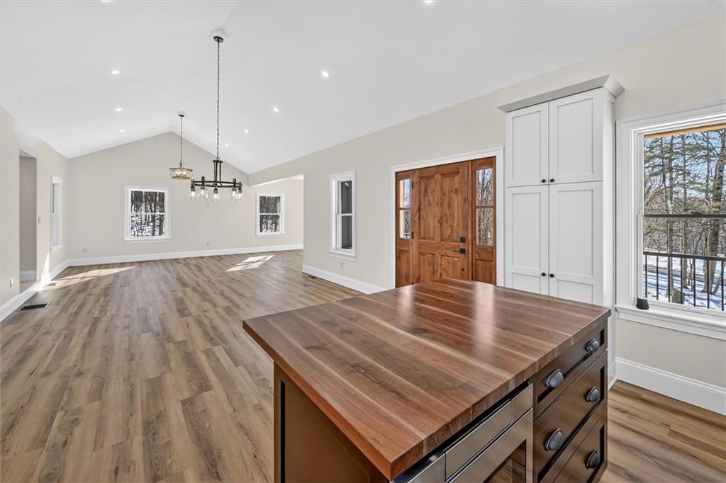 392 Stuber Road Beaver Falls, PA 15010 - Photo 15 of 48 a view of kitchen island a sink wooden floor dining table and chairs