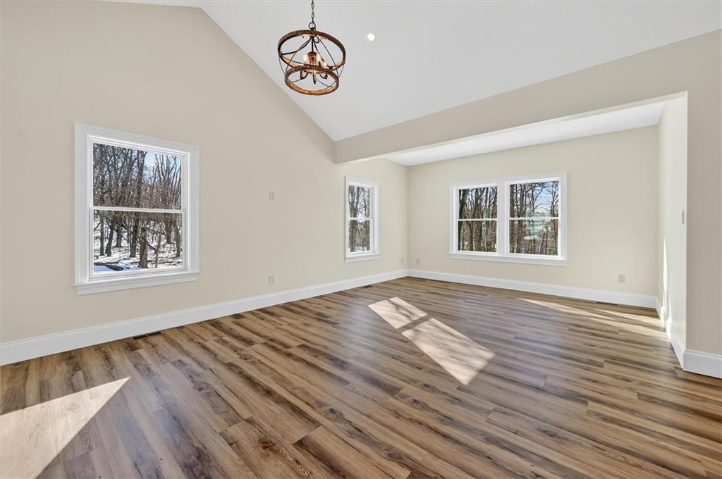 392 Stuber Road Beaver Falls, PA 15010 - Photo 17 of 48 a view of an empty room with window and wooden floor