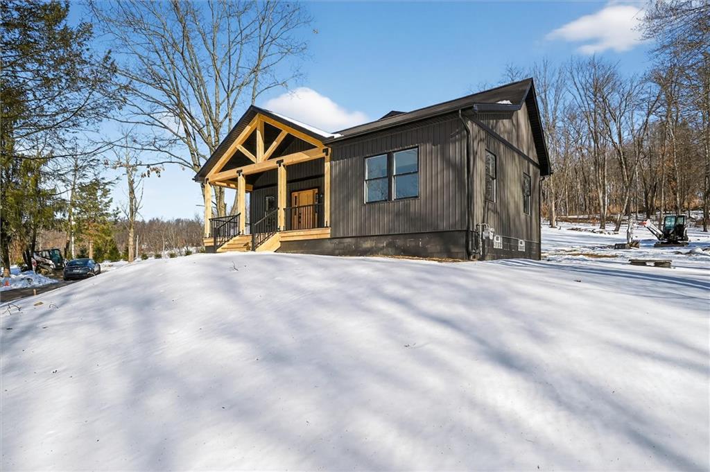 392 Stuber Road Beaver Falls, PA 15010 - Photo 4 of 48 a front view of a house with a yard