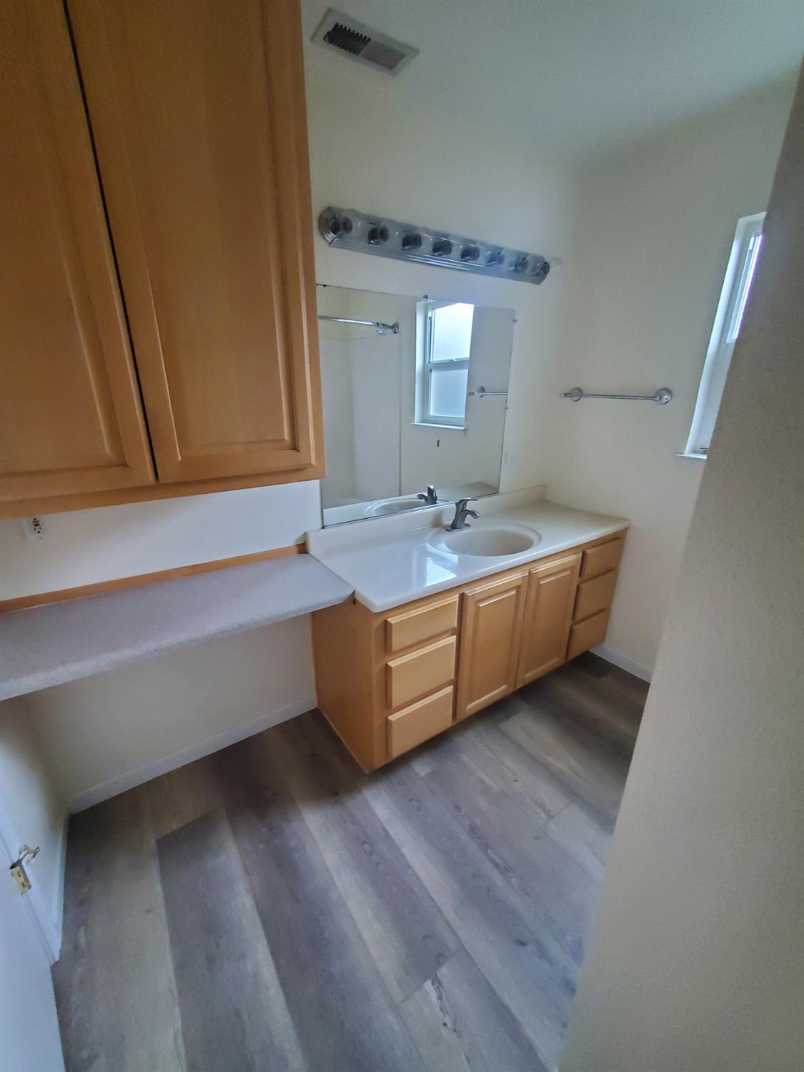 5817 Keyntel Street Citrus Heights, CA 95621 - Photo 26 of 30 a spacious bathroom with a double vanity sink and a mirror