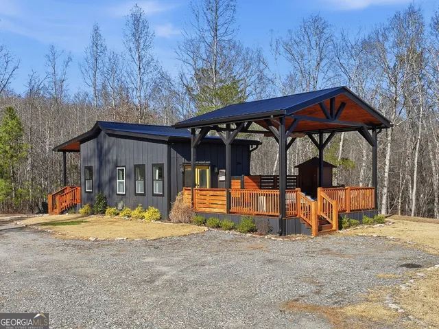 a view of a house with basketball court