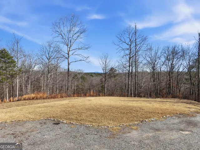 a view of a chair and table in the patio
