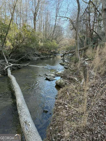 a view of a wooden floor with a lake view