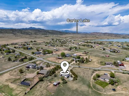 an aerial view of a house with outdoor space