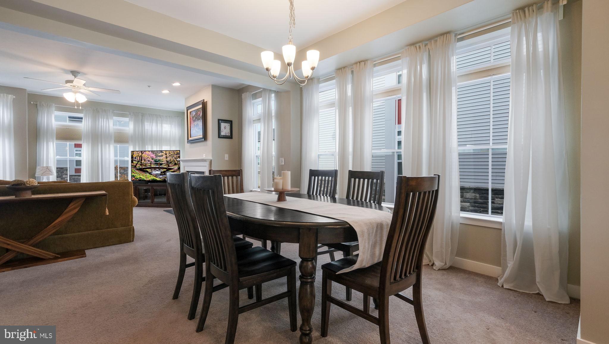 42 Independence Court Perkasie, PA 18944 - Photo 12 of 23 a view of a dining room with furniture and chandelier