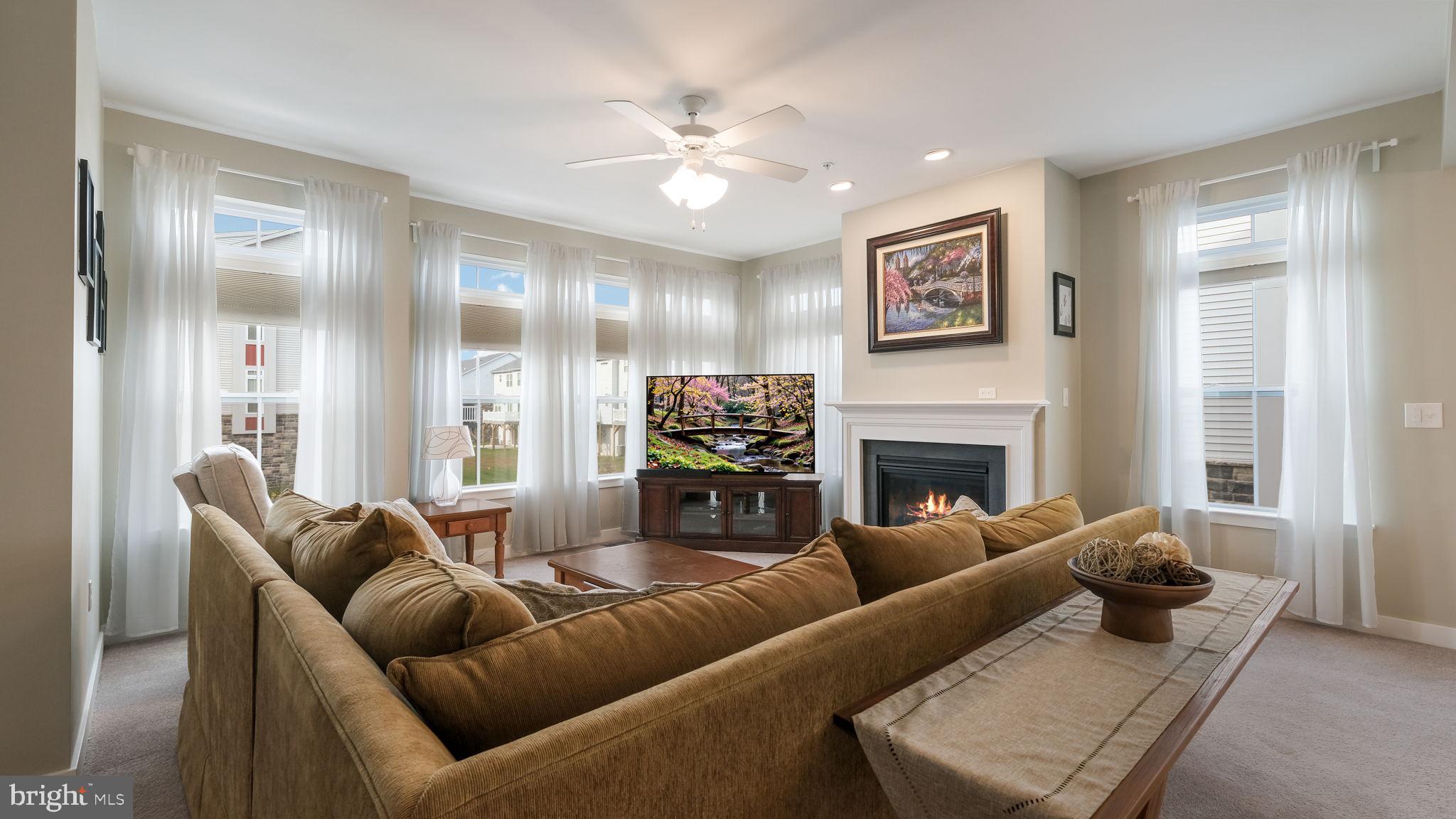 42 Independence Court Perkasie, PA 18944 - Photo 14 of 23 a living room with furniture a fireplace and a window