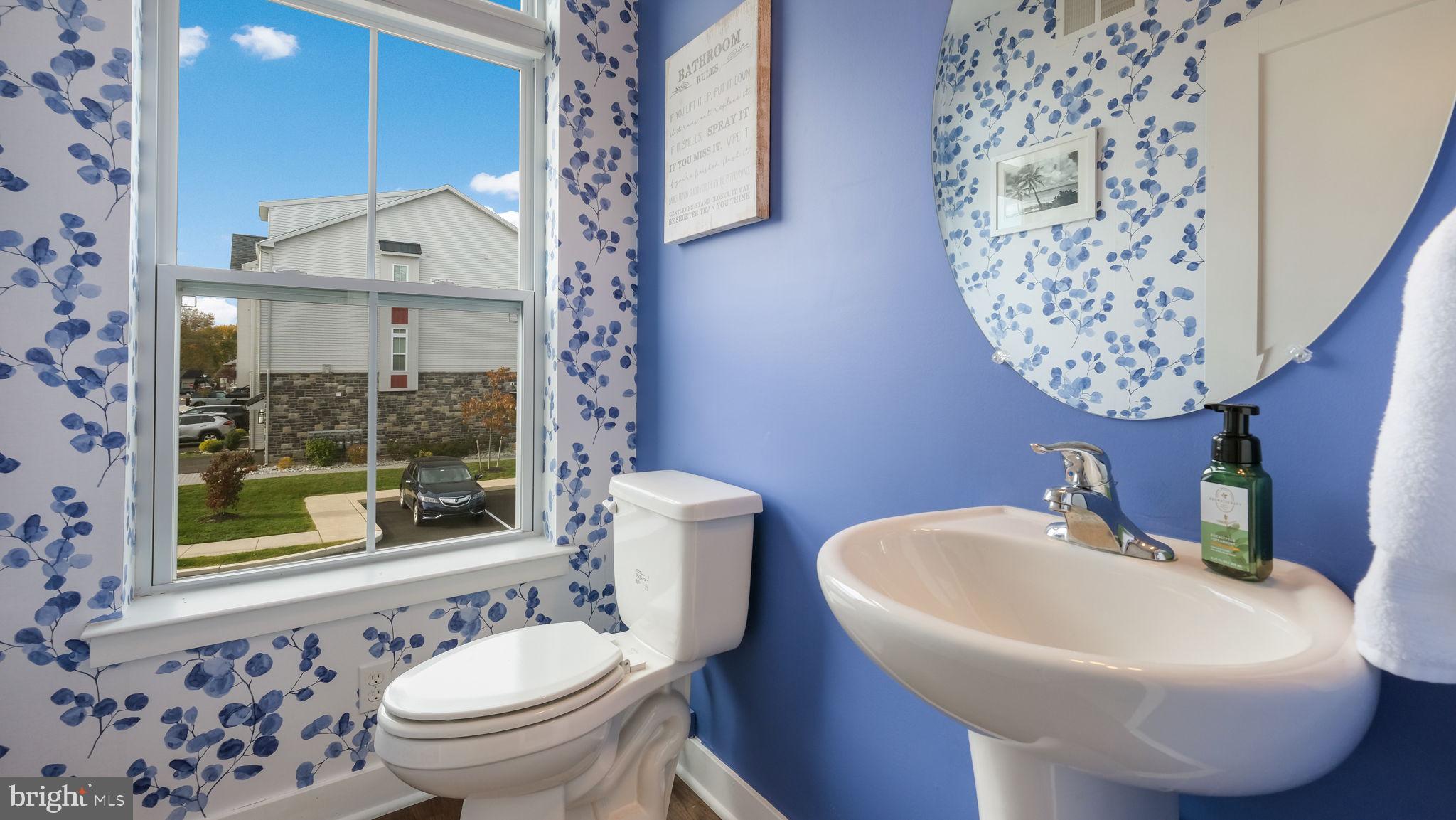 42 Independence Court Perkasie, PA 18944 - Photo 15 of 23 a bathroom with a toilet sink and mirror