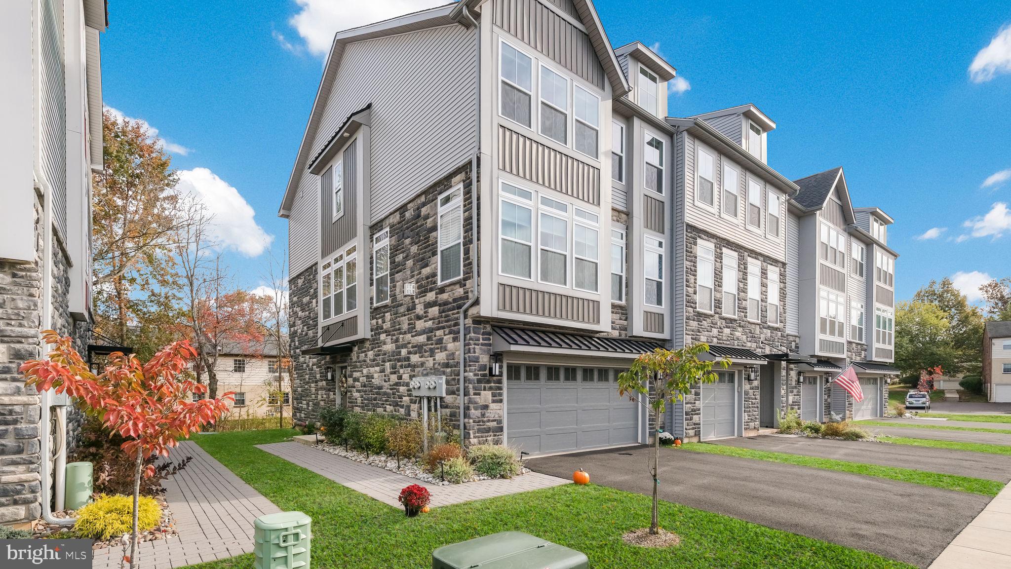 42 Independence Court Perkasie, PA 18944 - Photo 2 of 23 a view of a building and a yard