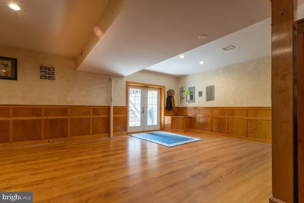 a living room with lots of furniture and kitchen view
