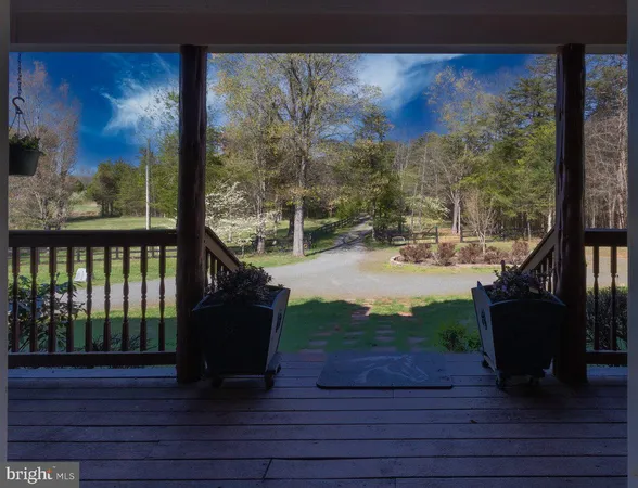 a view of two chairs in the balcony