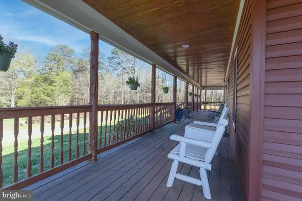a view of balcony with wooden floor