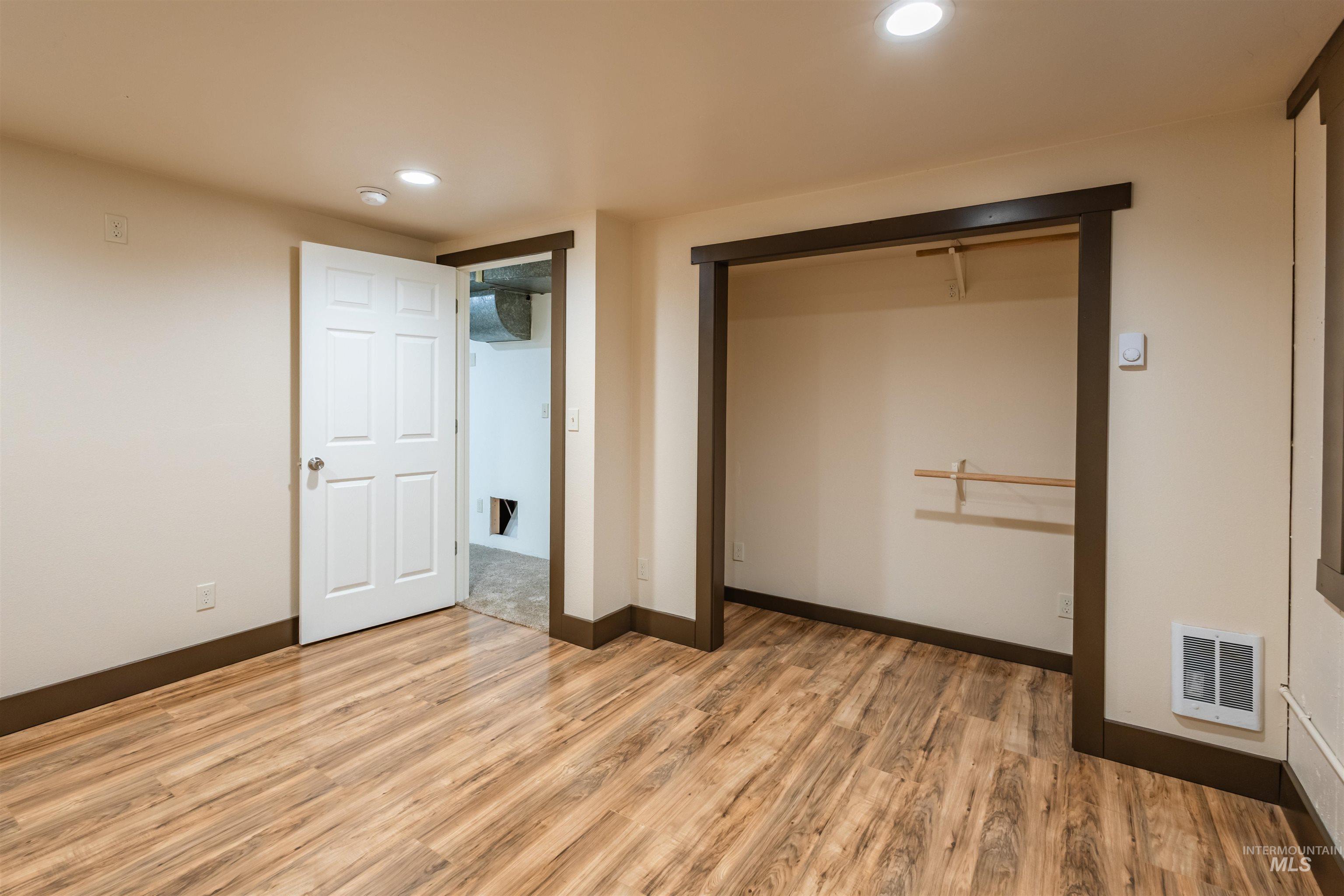 85 Northwest 16th Street Ontario, OR 97914 - Photo 13 of 25 Unfurnished bedroom featuring a closet, light wood-type flooring, and recessed lighting