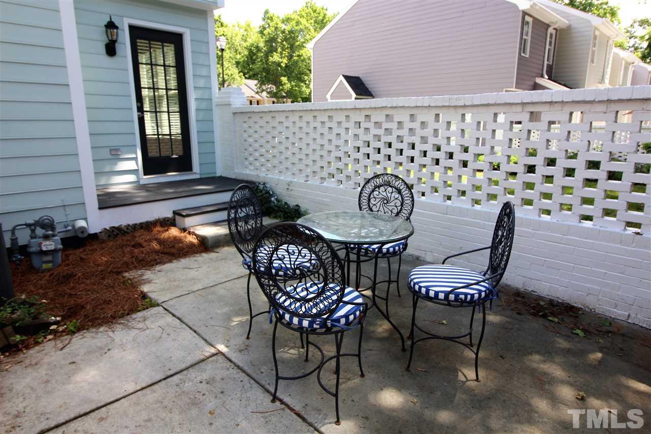 2514 Noble Road Raleigh, NC 27608 - Photo 14 of 16 a backyard of a house with table and chairs