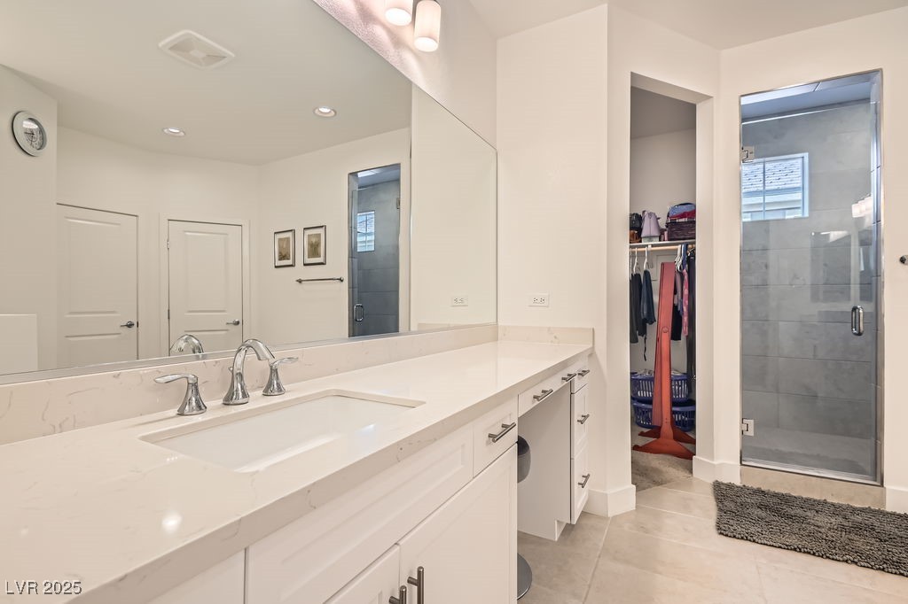 130 West Fairway Road Henderson, NV 89015 - Photo 16 of 40 Bathroom with vanity, light tile patterned floors, a shower stall, a walk in closet, and recessed lighting
