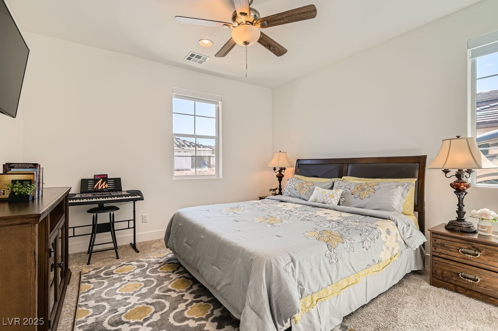130 West Fairway Road Henderson, NV 89015 - Photo 19 of 40 Bedroom with light carpet and a ceiling fan