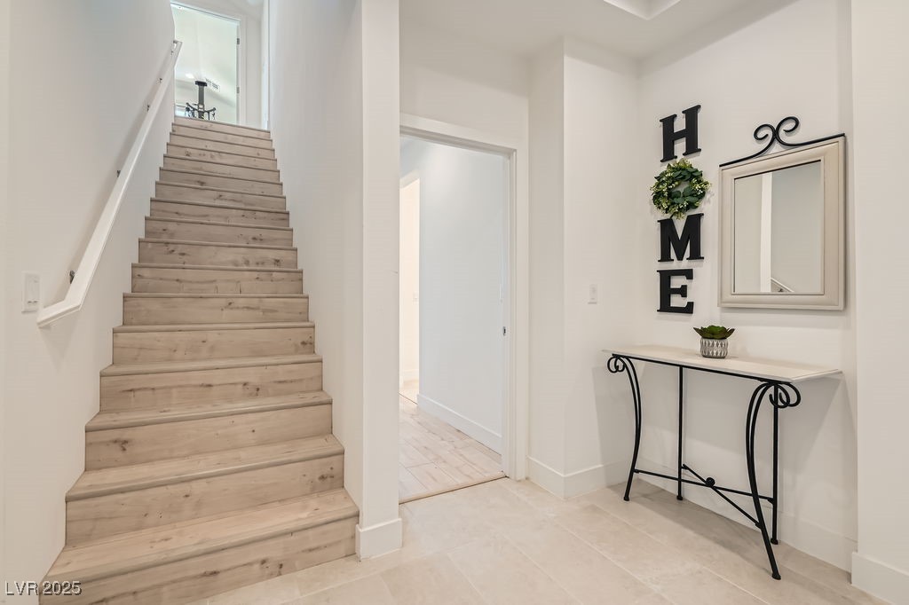 130 West Fairway Road Henderson, NV 89015 - Photo 25 of 40 Staircase featuring baseboards and tile patterned floors