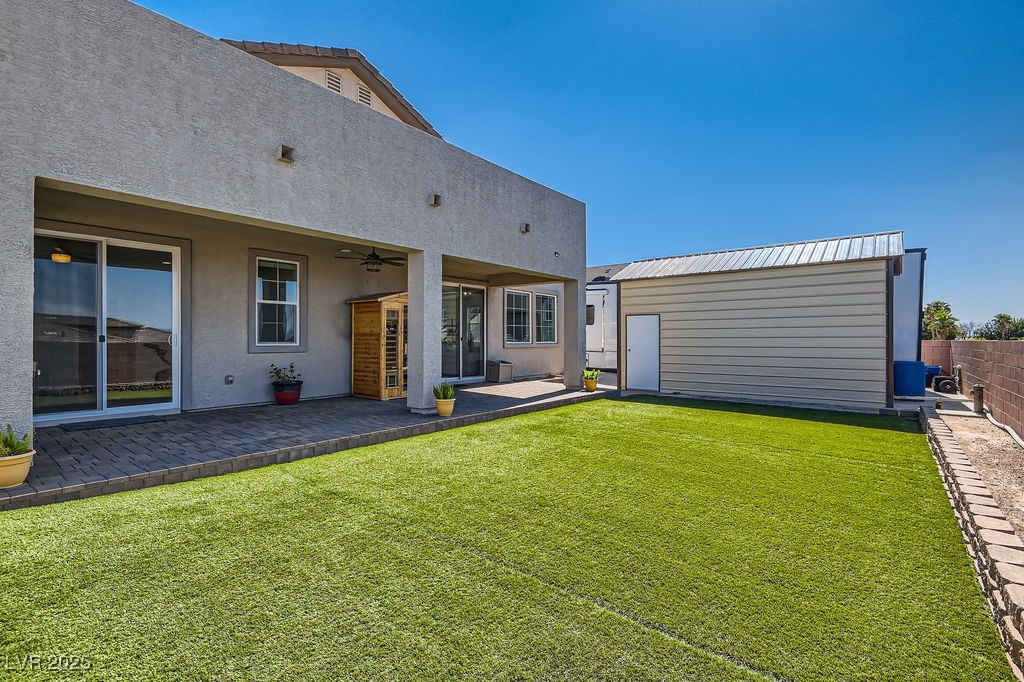 130 West Fairway Road Henderson, NV 89015 - Photo 34 of 40 Back of house featuring a patio, an outbuilding, stucco siding, and ceiling fan