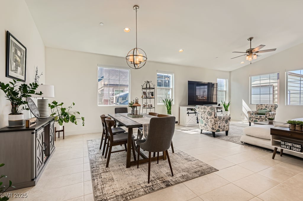 130 West Fairway Road Henderson, NV 89015 - Photo 8 of 40 Dining area featuring recessed lighting, light tile patterned floors, ceiling fan, vaulted ceiling, and a chandelier