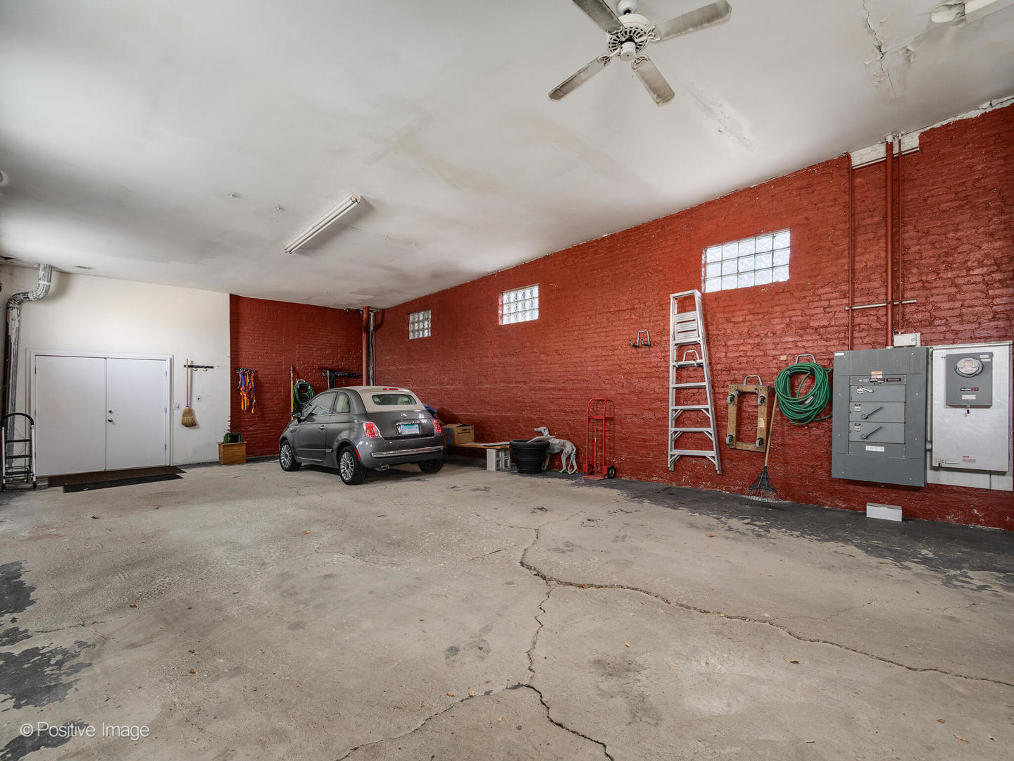 1244 West Chicago Avenue Chicago, IL 60642 - Photo 22 of 22 a car parked in front of garage