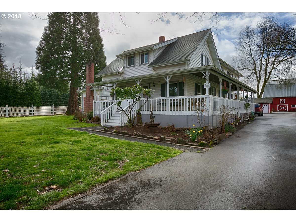 36980 Southeast Hauglum Road Sandy, OR 97055 - Photo 1 of 31 a front view of a house with a garden